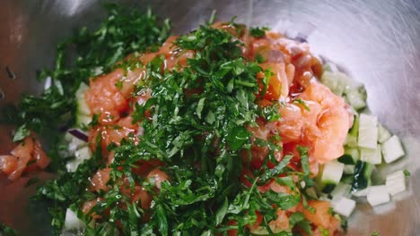 Salad-of-tomato,-cucumber-and-parsley-water-with-oil-in-4k-resolution-in-slowmotion