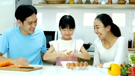 Little-girl-and-mother-talking-together-with-relax-emotion-at-kitchen.-P