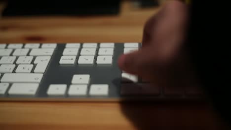 Businessman-with-suit-hands-typing-in-the-desk-office