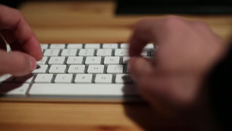 Businessman-with-suit-hands-typing-in-the-desk-office