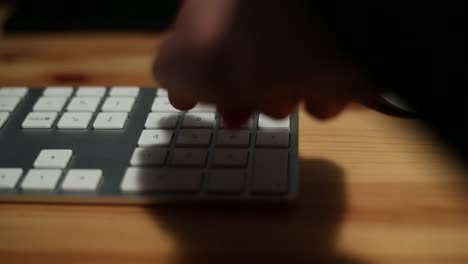 Businessman-with-suit-hands-typing-in-the-desk-office