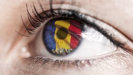 woman-green-eye-in-close-up-with-the-flag-of-Romania-in-iris-with-wind-motion.-video-concept
