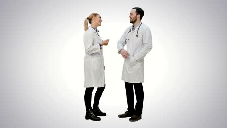 Doctors-friends-give-each-other-five-and-thumb-up-on-white-background