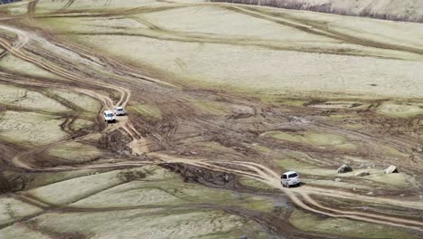 Off-road-vehicle-crossing-mountain-top-moving-down