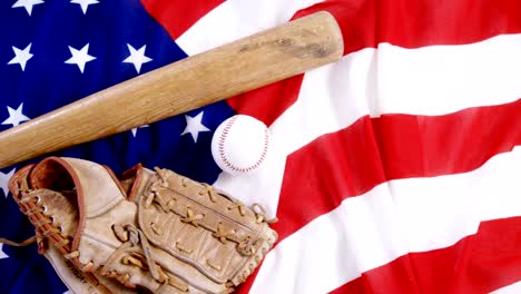 Baseball,-baseball-bat-and--baseball-gloves-on-an-American-flag