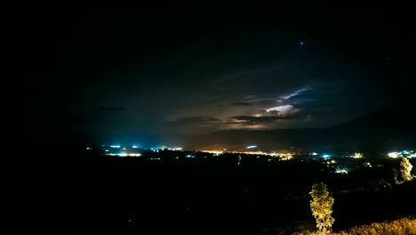 Lightning-at-Night,-seeing-the-Stars-in-the-Sky-Above-Swamp-in-the-Green-Valley.