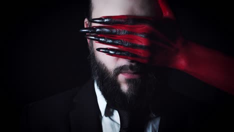 4k-Horror-Devil's-Hand-Covering-Businessman-Eyes