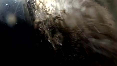 Car-Wheel-Driving-Through-Deep-Puddle-POV