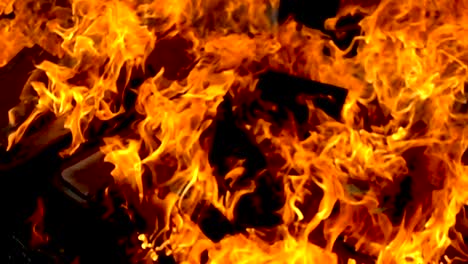 Close-up-of-fire-burn-wood-pile-with-slow-motion