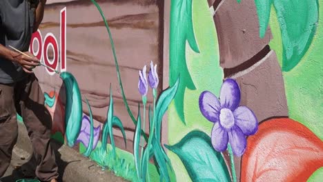 Mural-painter-draws-garden-on-the-school-wall