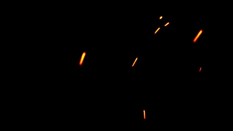 fire-sparks-from-campfire-with-ash-rise-over-black-background,-danger-explosion