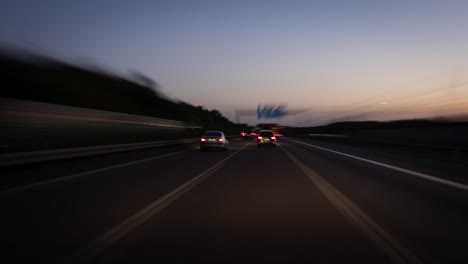 Driving-on-a-highway-at-dusk