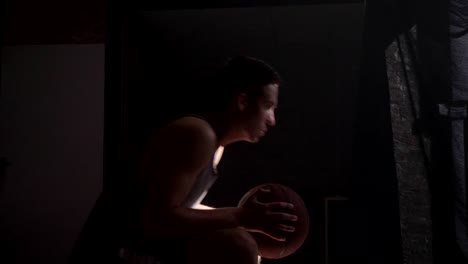 Basketball-player-sitting-and-waiting-for-game-to-start,-going-to-playground