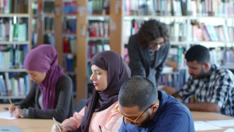 Group-of-Middle-Eastern-Migrants-Studying-at-School