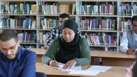 Muslim-Woman-Writing-at-Lesson