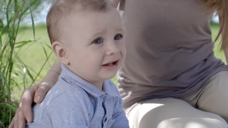 Mother-Calming-Fussy-Baby-in-Park