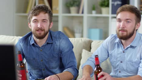 Twins-Watching-TV-and-Drinking-Beer