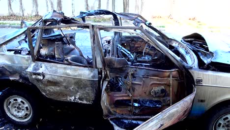 The-blown-up-car-as-a-result-of-terrorist-attack.	Car-after-terrorist-attack.