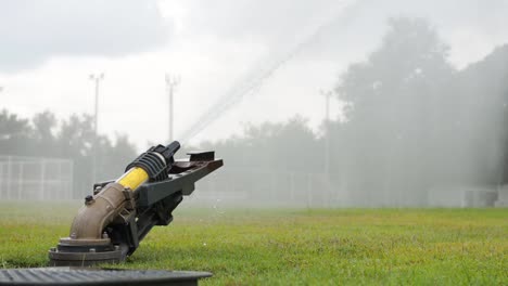 Watering-a-green-football-field