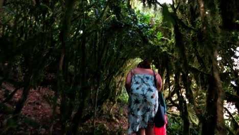 Mother-walking-through-an-old-maze-tunnel-playing-hide-and-seek