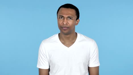 Sad-Upset-African-Man-Isolated-on-Blue-Background