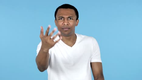 Fighting-Young-African-Man-in-Anger-Isolated-on-Blue-Background