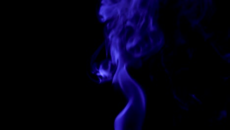 Blue-Steam-Rises-from-up.-Blue-smoke-over-a-black-background.-Smoke-slowly-floating-through-space-against-black-background.-Slow-Motion.