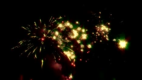 Bright-fireworks-on-the-background-of-the-night-sky-on-New-Year's-Eve.-Looped