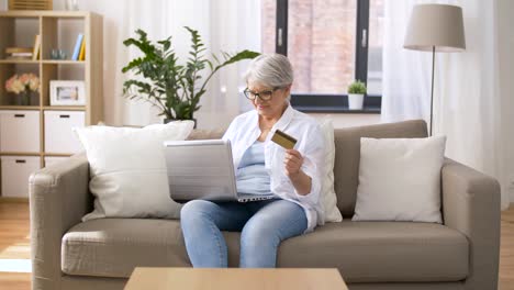 senior-woman-with-laptop-and-credit-card-at-home
