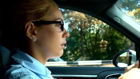 Displeased-lady-boss-driving-car,-upset-with-phone-conversation-problems-at-work