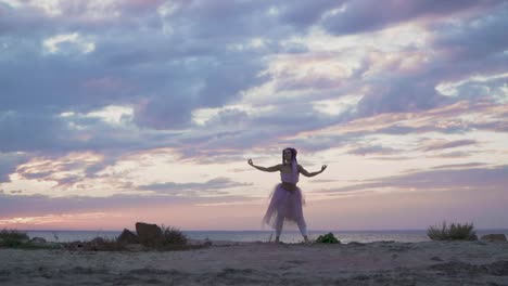 Lovely-young-woman-with-sparkling-makeup-in-a-pink-dress-dancing-on-the-bank-of-the-river.-The-dance-of-a-tender-girl-with-a-flower-hairstyle.-Slow-motion.