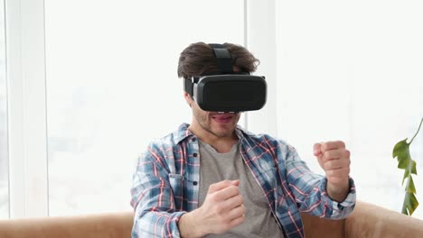 Man-driving-in-virtual-reality-wearing-vr-headset