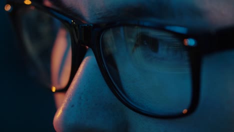 close-up-of-hacker-in-glasses-looking-at-screen