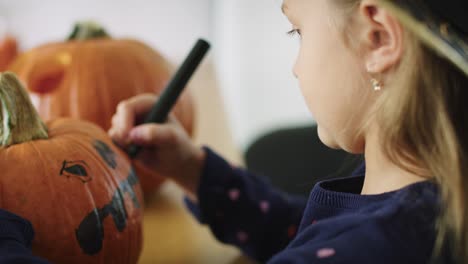 Girl-making-decorations-for-Halloween