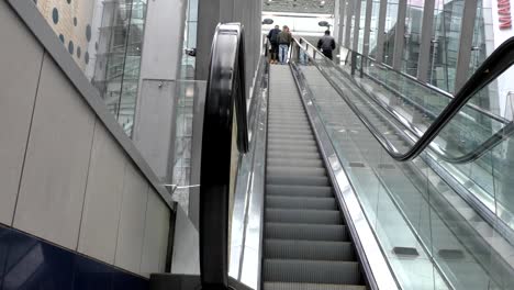 People-moving-up-on-escalator