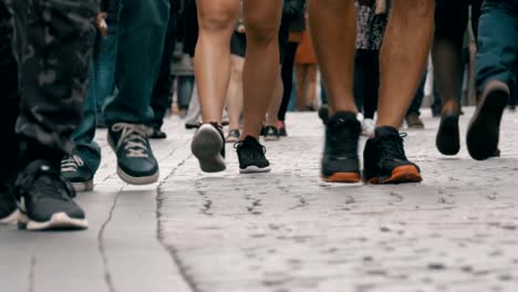 Legs-of-Crowd-People-Walking-on-the-Street