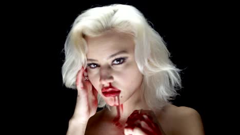 Fashion-blonde-with-bloody-hands-and-face