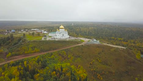 Aerial-View-of-Famous-Church-And-Landmark,-Golden-Yellow-Domes-on-outdoor-at-Autumn-Season.-Clip.-Top-view-on-church-in-autumn