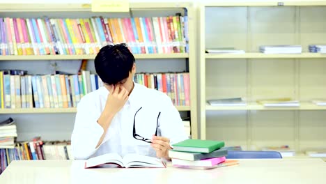 Study-hard-in-library.-Young-Chinese-boy-study-hard-at-library.