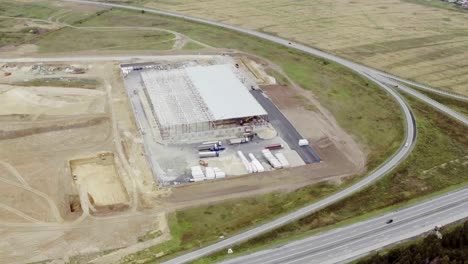 Aerial-footage-of-building-new-large-warehouse