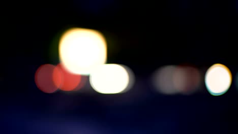 blurred-night-city-life,-car-lights-at-night,-colorful-bokeh,-abstract-background