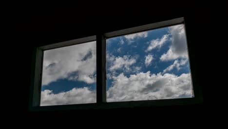 Time-lapse-shot-of-old-windows-with-clouds-moving-in-background