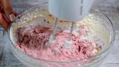 Mixing-cream-of-vanilla-and-berry-fruits.