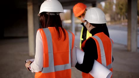 The-engineer-and-two-women-inspector-conduct-an-inspection-and-bypass-the-construction-site.