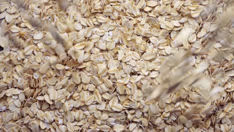 Slow-motion-closeup-oat-flakes-falling-into-bowl