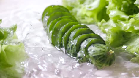 Falling-of-sliced-cucumber-into-the-wet-table.-Slow-motion-480-fps