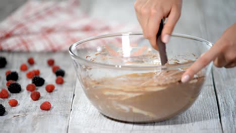 Batter-being-created-in-a-glass-mixing-bowl-in-the-kitchen.