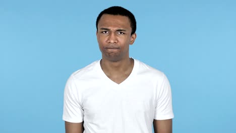 African-Man-Shaking-Head-to-Reject-Isolated-on-Blue-Background