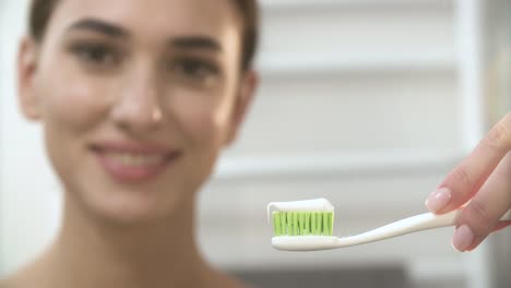 Teeth-Hygiene.-Woman-Applying-Toothpaste-On-Toothbrush-Closeup