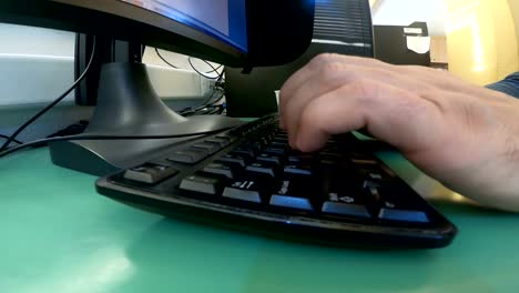 Hacker-developer-hands-fast-typing-malicious-code-on-computer-keyboard-in-the-office